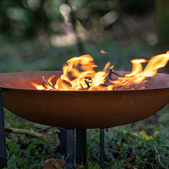 Garden fire features: Our guide to log-burning fire pits, bowls, globes, baskets, and chimineas